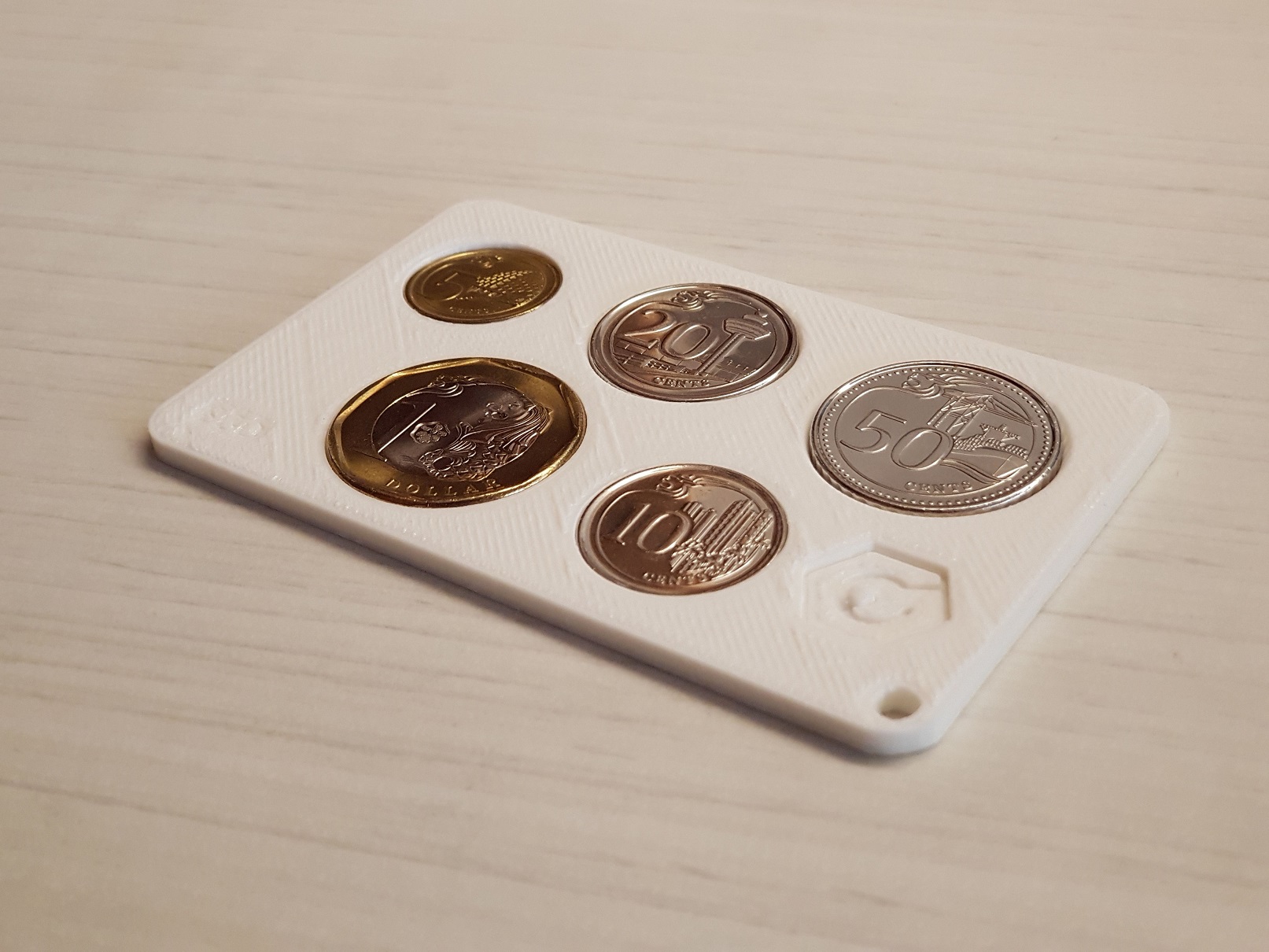 Version 1 of the 3D-printed coin card prototype.